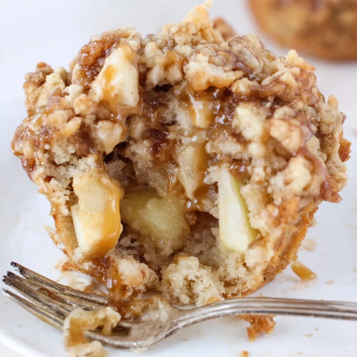Warm Caramel Apple Crunch Cookie Muffins, bursting with apples and rich caramel flavor.
