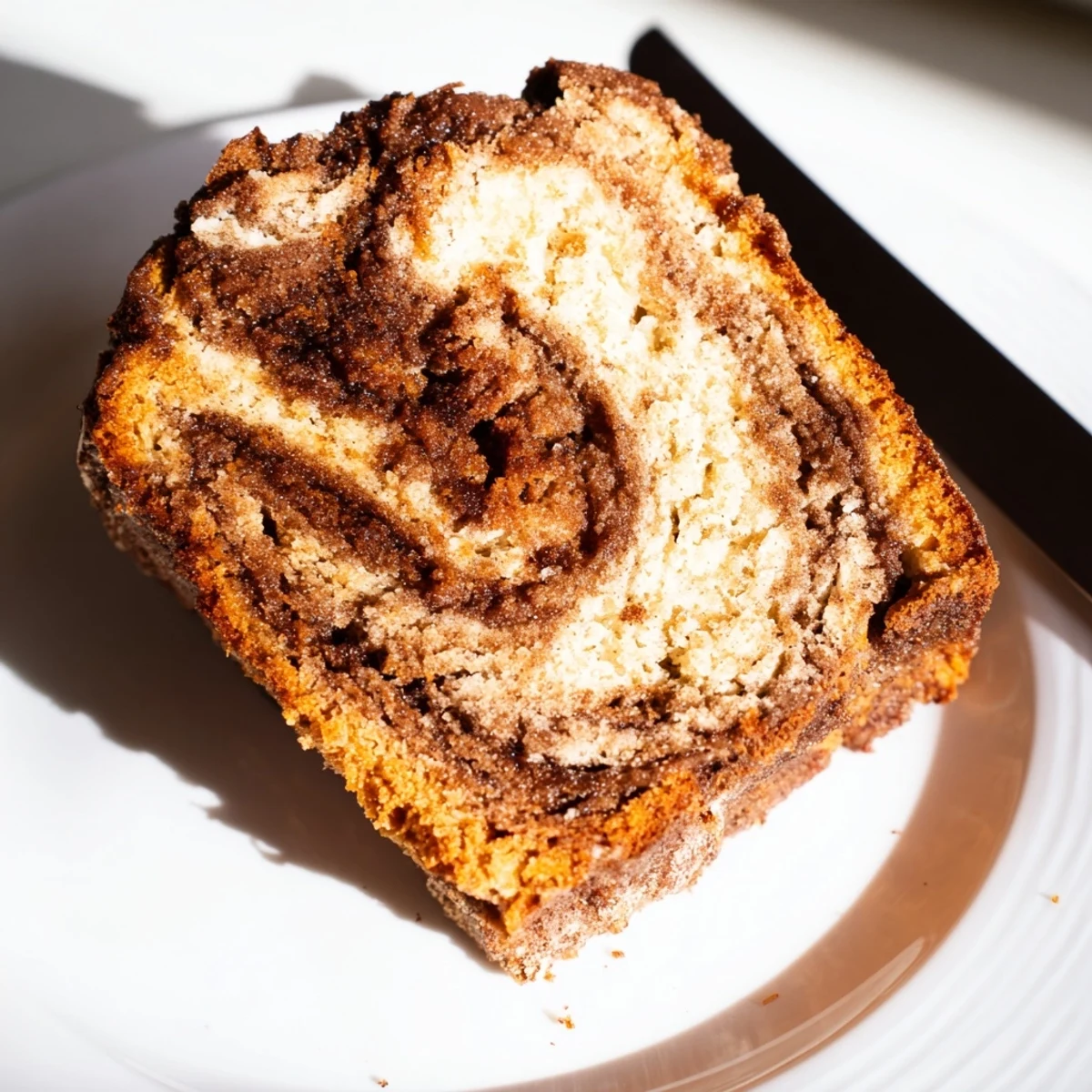 Golden-brown Churro Sweet Potato Chaos Bread, featuring a creamy swirl and crunchy crust.  