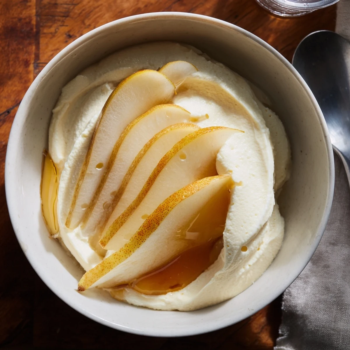 Delicate sweet ricotta topped with juicy fruit slices for a refreshing dessert.  