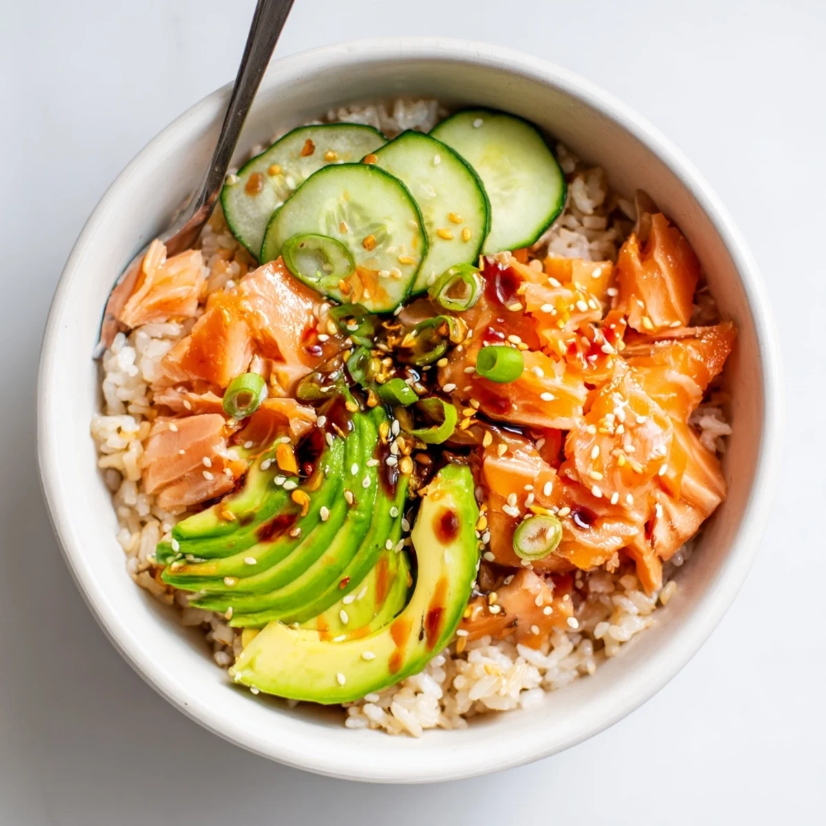 Microwave-steamed Leftover Salmon & Rice Bowl topped with sesame seeds and scallions.  