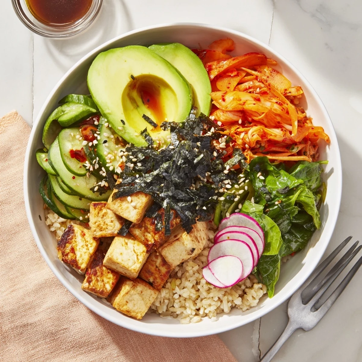 Vibrant Fermented Vegetable Bowl showcasing hearty grains, kimchi, and creamy avocado slices.  