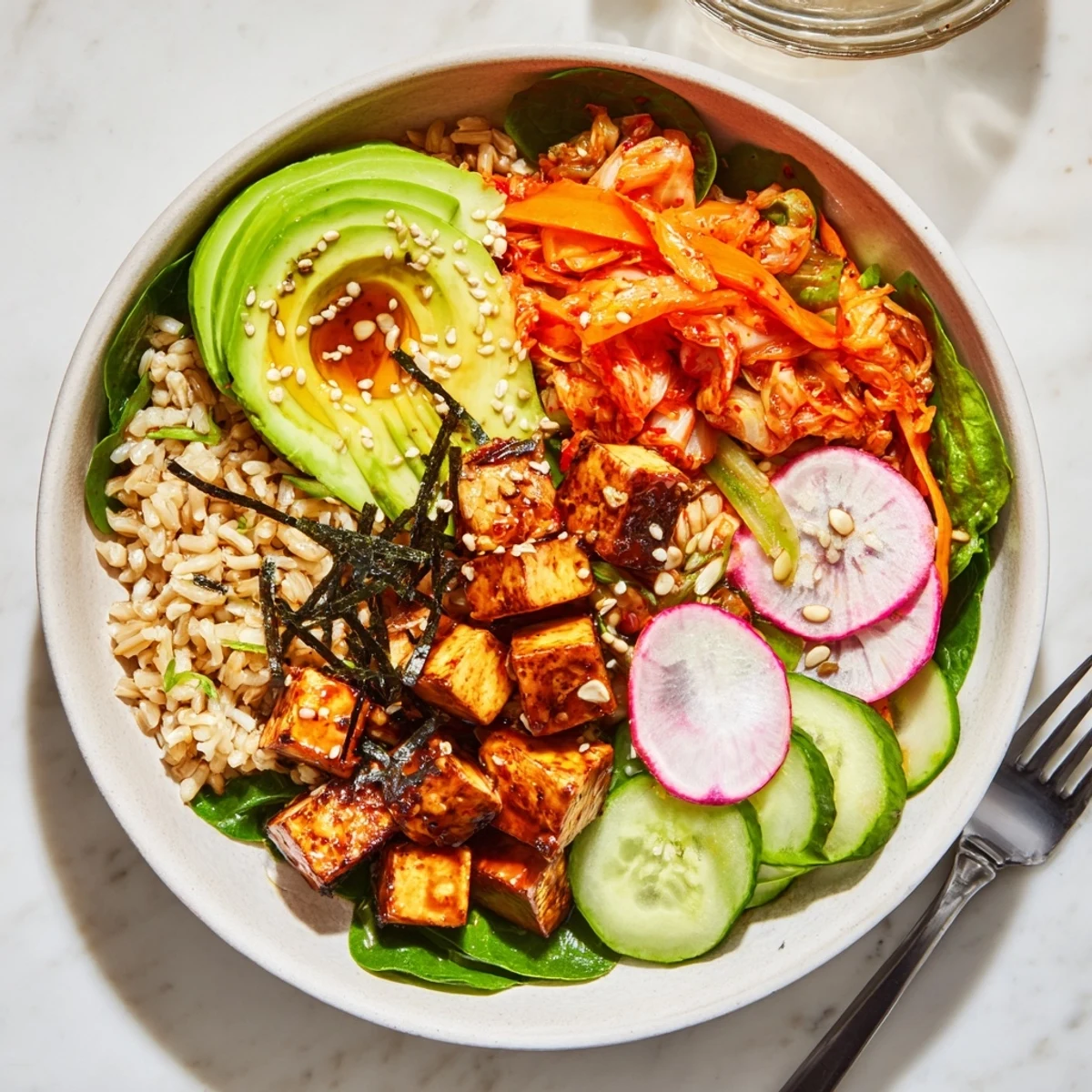 Delicious Fermented Vegetable Bowl topped with bright radishes, wholesome grains, and spicy chili flakes.
