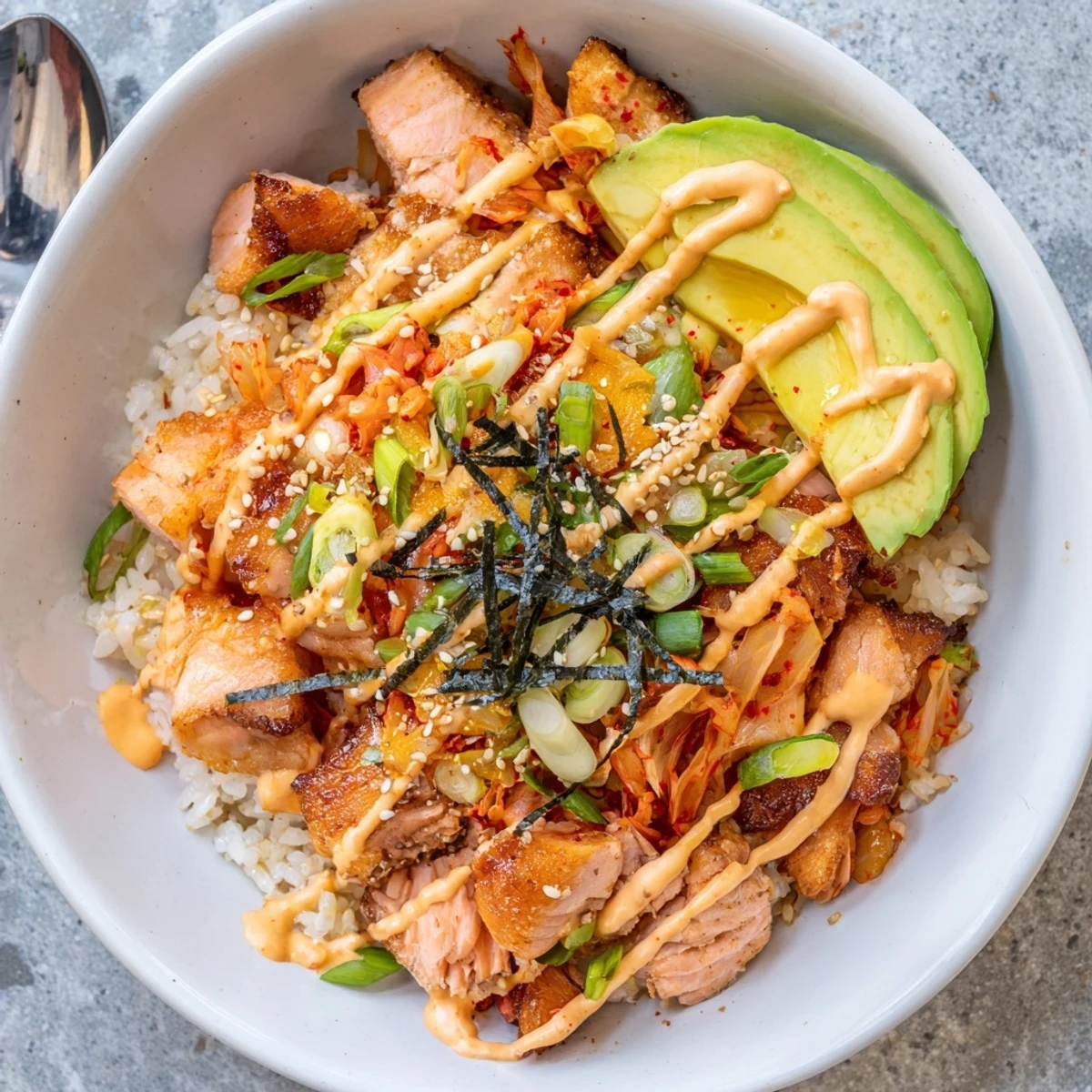 Enjoy the vibrant crispy salmon rice bowl, bursting with zesty flavors and textures.