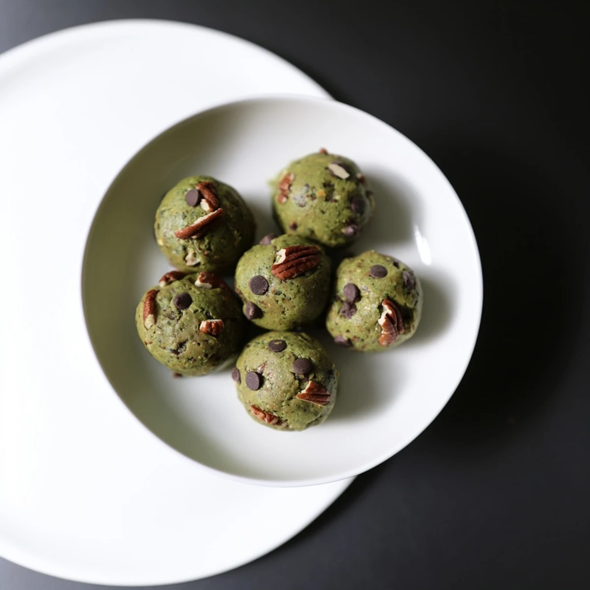 These homemade Matcha Gingerbread Cookie Dough Protein Bites, full of flavor, are a delicious post-workout recovery treat.