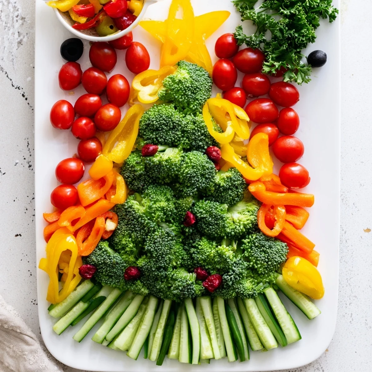 Bright and inviting, a Christmas veggie platter tree with a vibrant arrangement of fresh vegetables for the holidays.