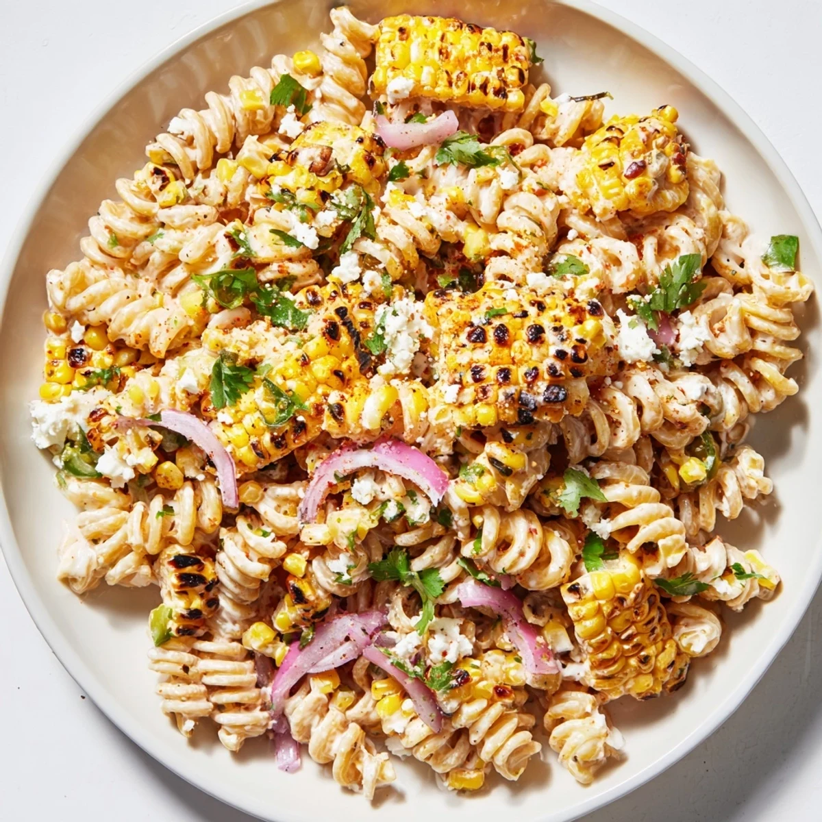 Creamy Street Corn Pasta Salad with charred corn kernels and a vibrant, creamy dressing ready to eat.