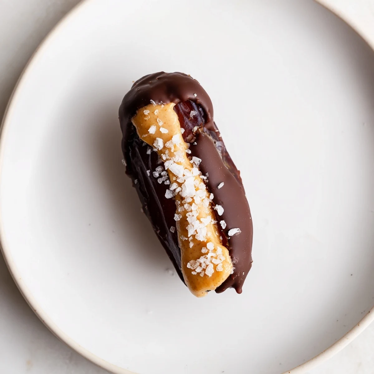 Glistening chocolate covering these homemade chocolate peanut butter dates, ready to eat after a slight chill.