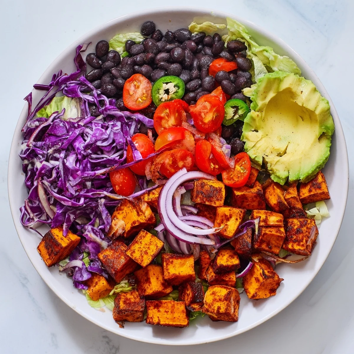 Healthy sweet potato taco bowls, showcasing tender roasted sweet potatoes and vibrant toppings.