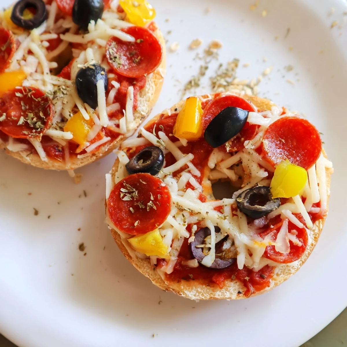 Golden, bubbly mini bagel pizzas with melted mozzarella and savory pepperoni topping.