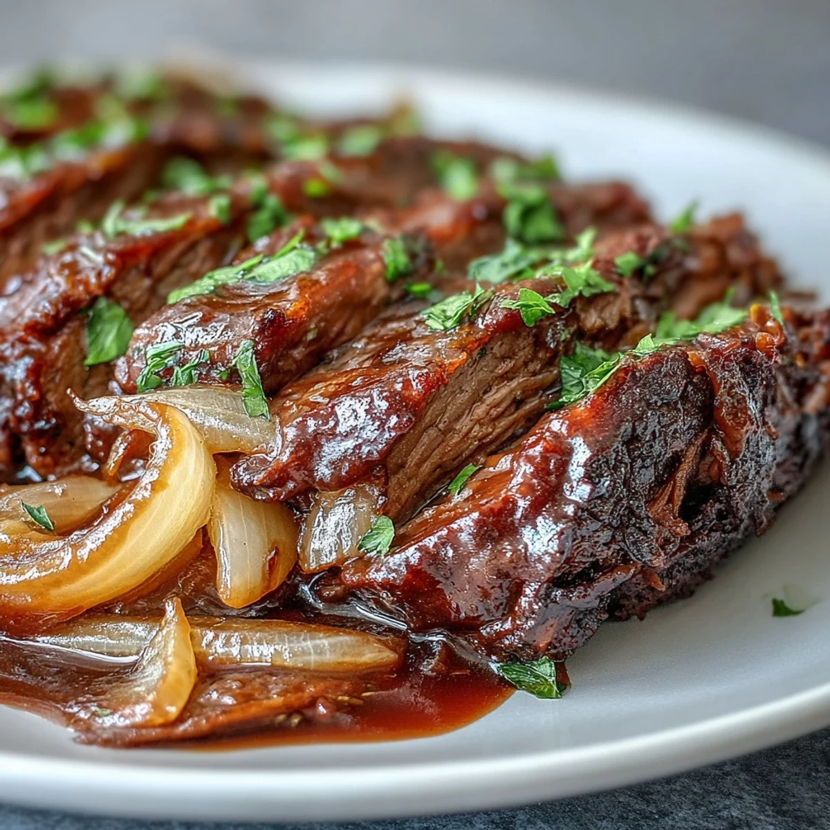 Savory Crock Pot French Onion Pot Roast with melted Gruyere and fresh parsley in a slow cooker.