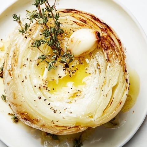 Juicy, roasted onion boil with tender, caramelized layers, herbs, and melted butter—a perfect side.