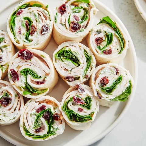 Savory turkey cranberry pinwheels, beautifully sliced and ready: a perfect holiday appetizer.