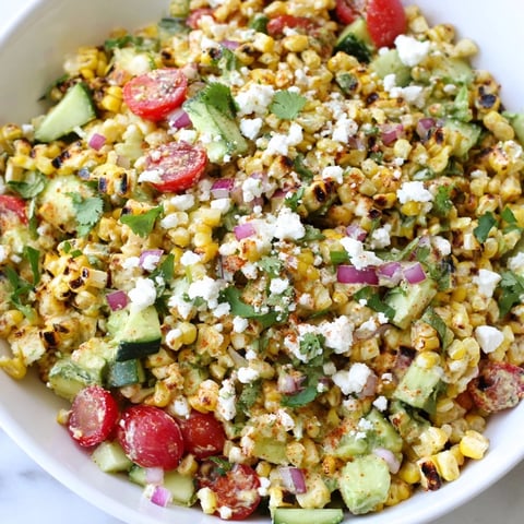 Smoky, charred corn is mixed with fresh veggies in this Mexican Street Corn Chopped Salad.