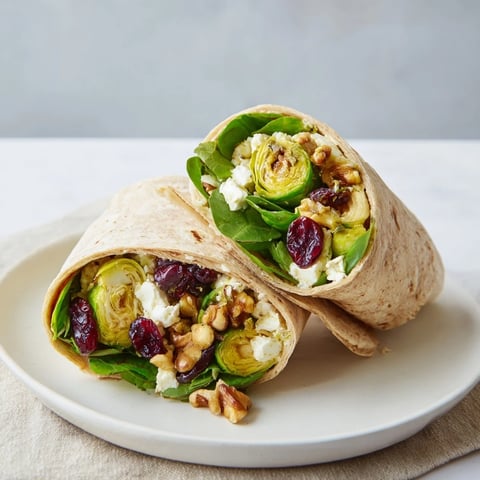 Golden brown Roasted Brussels Sprouts & Cranberry Grain Wrap, perfect for a flavorful vegetarian lunch.