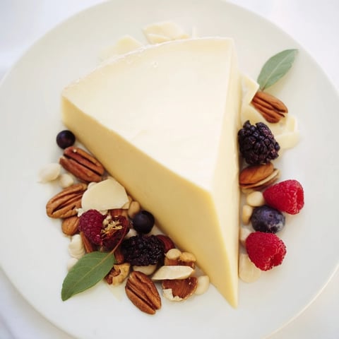 Impressive Shooting Star Cheese Board ready, with vibrant berries and nutty tail, perfect for an appetizer.