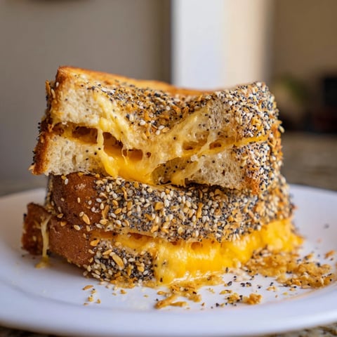 Golden, melted Everything Bagel Grilled Cheese oozing cheese, a perfect comfort food classic.