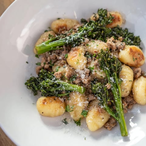 Golden, crispy Sheet Pan Gnocchi Bake: rustic Italian flavors mingling with tender broccolini and sausage.