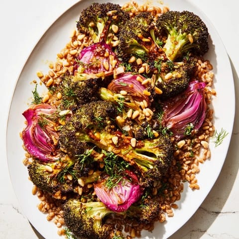 Bright image of Warm Roasted Broccoli with Garlic-Lemon & Farro, showcasing tender roasted vegetables and grains.