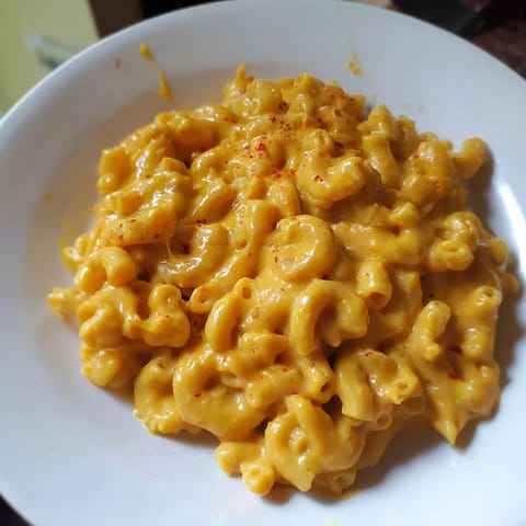Warm, golden one-pot butternut squash mac & cheese, bubbling and ready for a comforting meal.