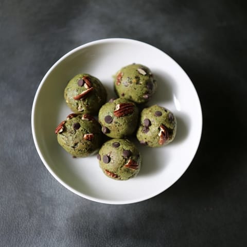 Vibrant image of Matcha Gingerbread Cookie Dough Protein Bites, textured and spiced, ready to chill and enjoy.