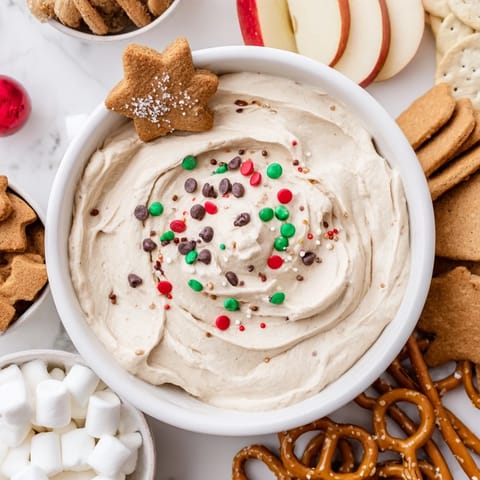 Creamy, spiced Gingerbread House Dip Board, perfect for sharing and scooping on various treats.