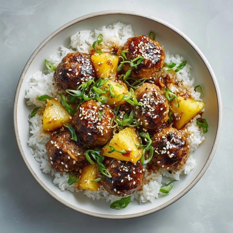 Close-up of homemade Pineapple Teriyaki Meatballs, coated in rich sauce, perfect for a flavorful dinner.