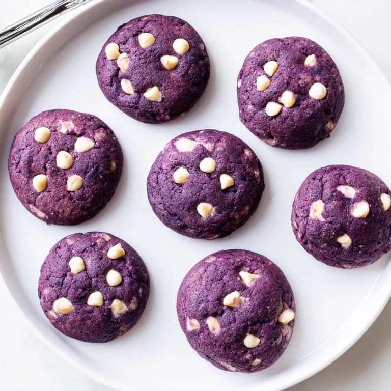 Chewy ube cookies with white chocolate chips on a decorative tray for holiday enjoyment.