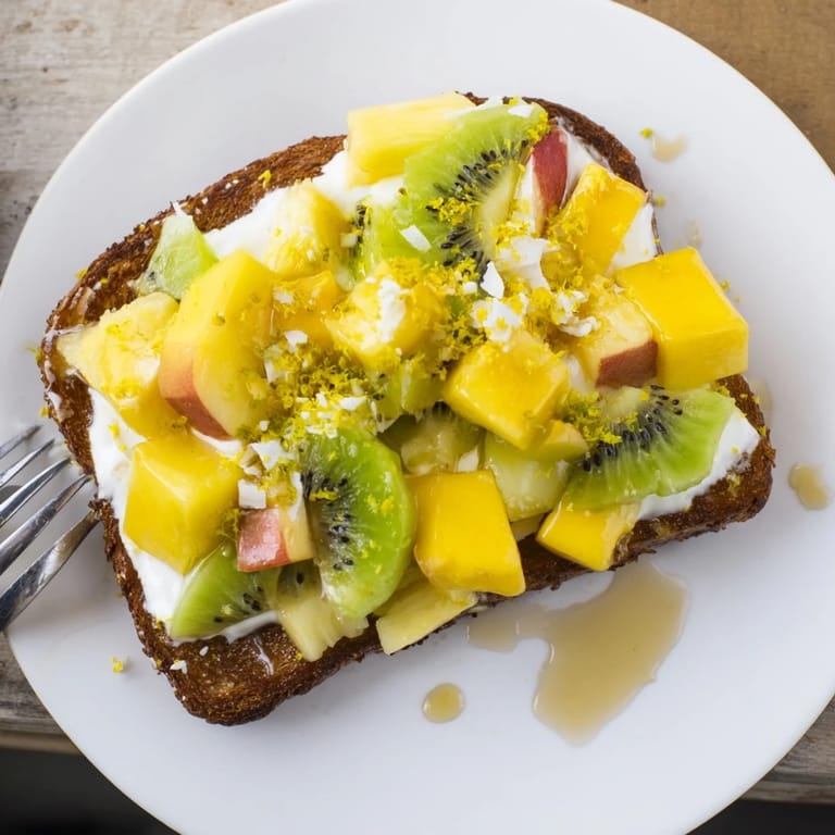 Freshly made Yogurt-Custard Toast 2.0, showcasing creamy coconut and colorful toppings.