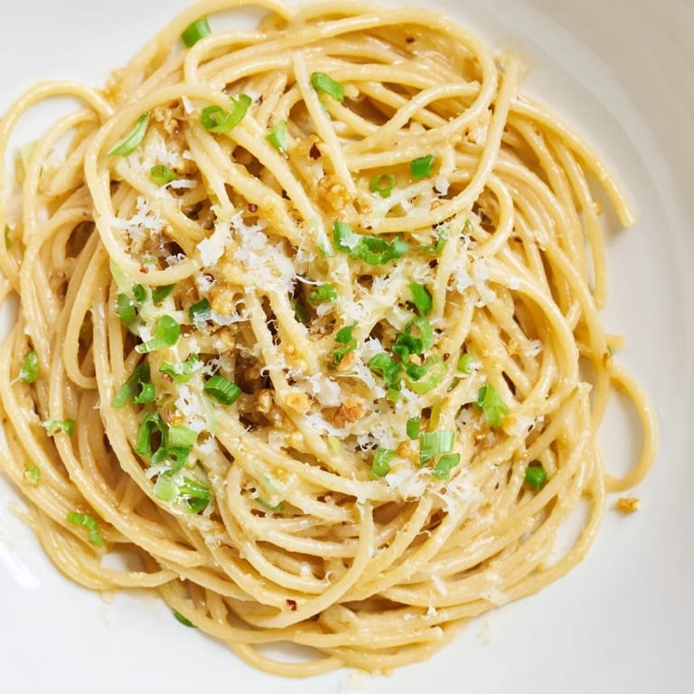 Close-up of savory miso butter pasta, a delicious quick dinner with garlic and pepper flavors.